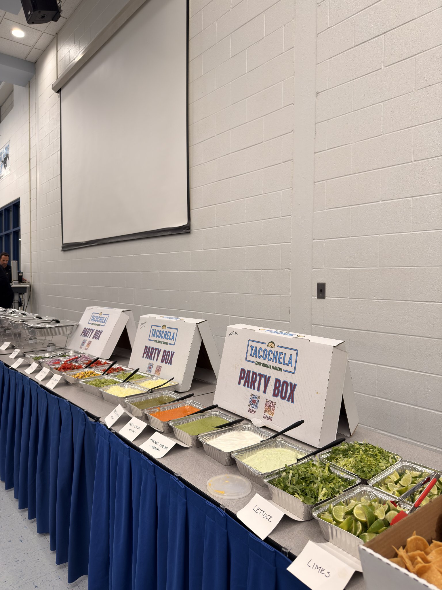 Tacochela catering toppings line with fresh salsas and toppings
